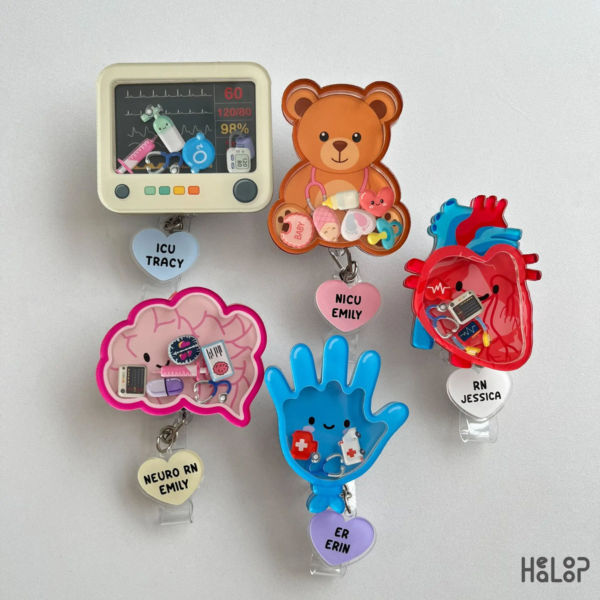 custom shaker badge reel collection with medical designs, selectable charms, and personalized nurse name dangles