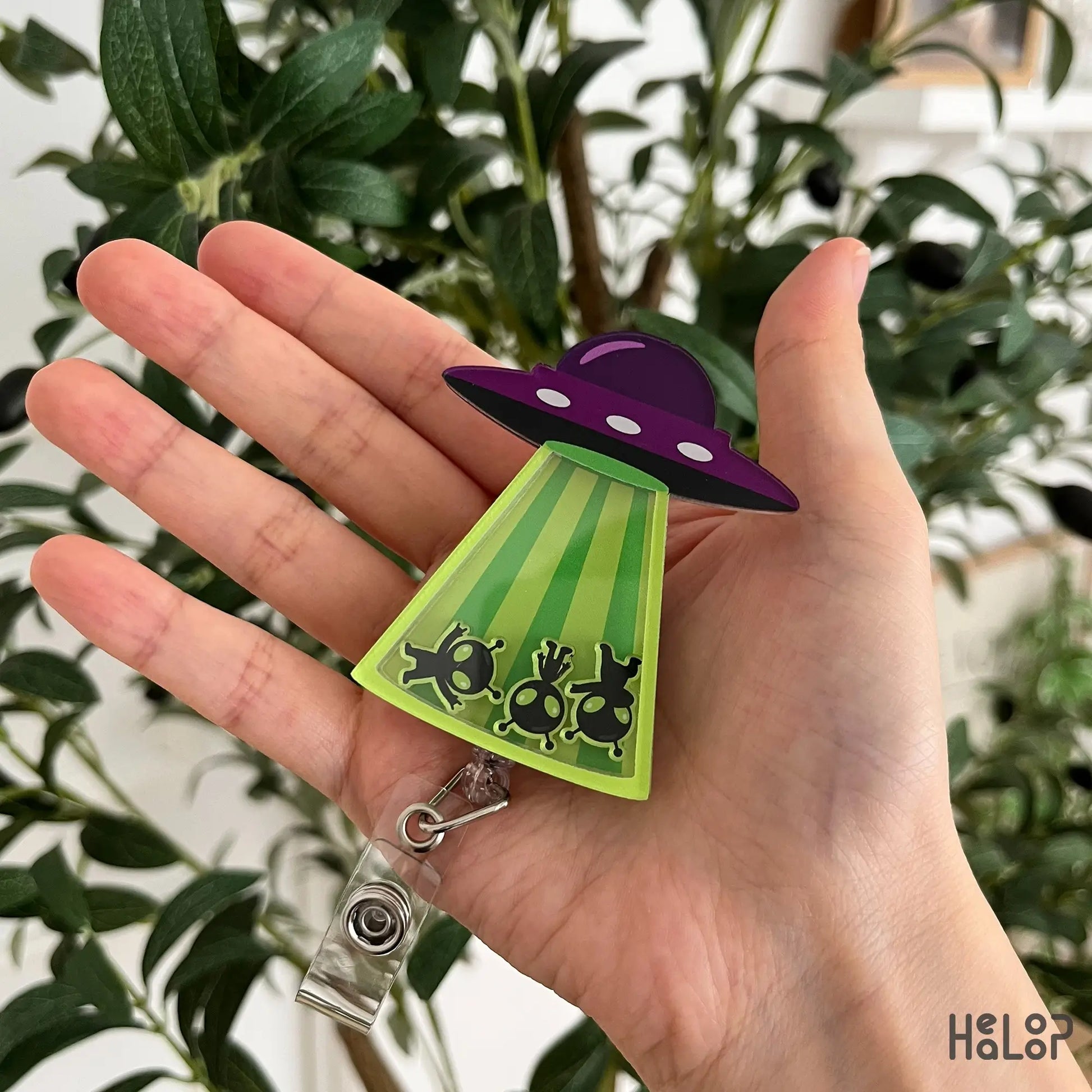 Cute Alien UFO Shaker Badge Reel featuring movable alien charms inside a colorful UFO beam, retractable badge holder for healthcare professionals.
