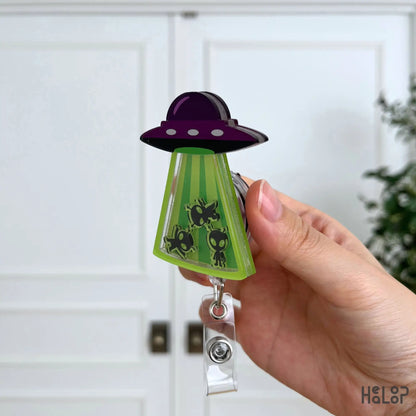 Side profile of the Cute Alien UFO Shaker Badge Reel highlighting its premium layered acrylic construction.