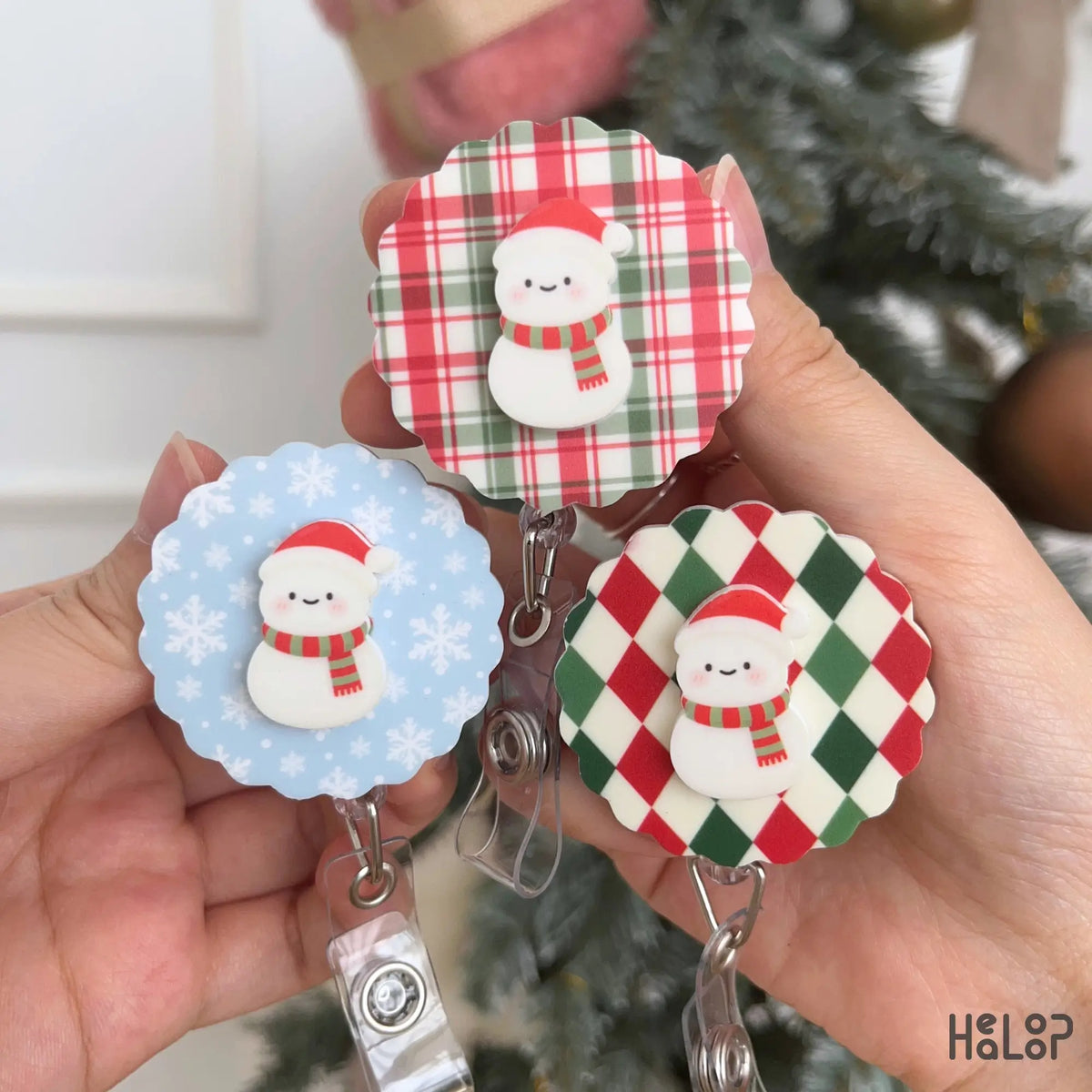 Cute Christmas Snowman Badge Reel collection showing three festive background designs for holiday ID badges