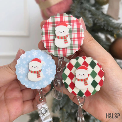 Cute Christmas Snowman Badge Reel collection showing three festive background designs for holiday ID badges