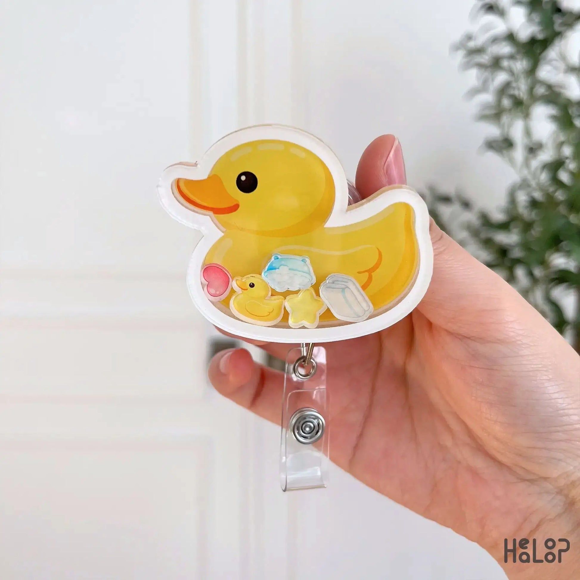 Cute duck shaker badge reel with baby themed charms designed for nurses and healthcare workers