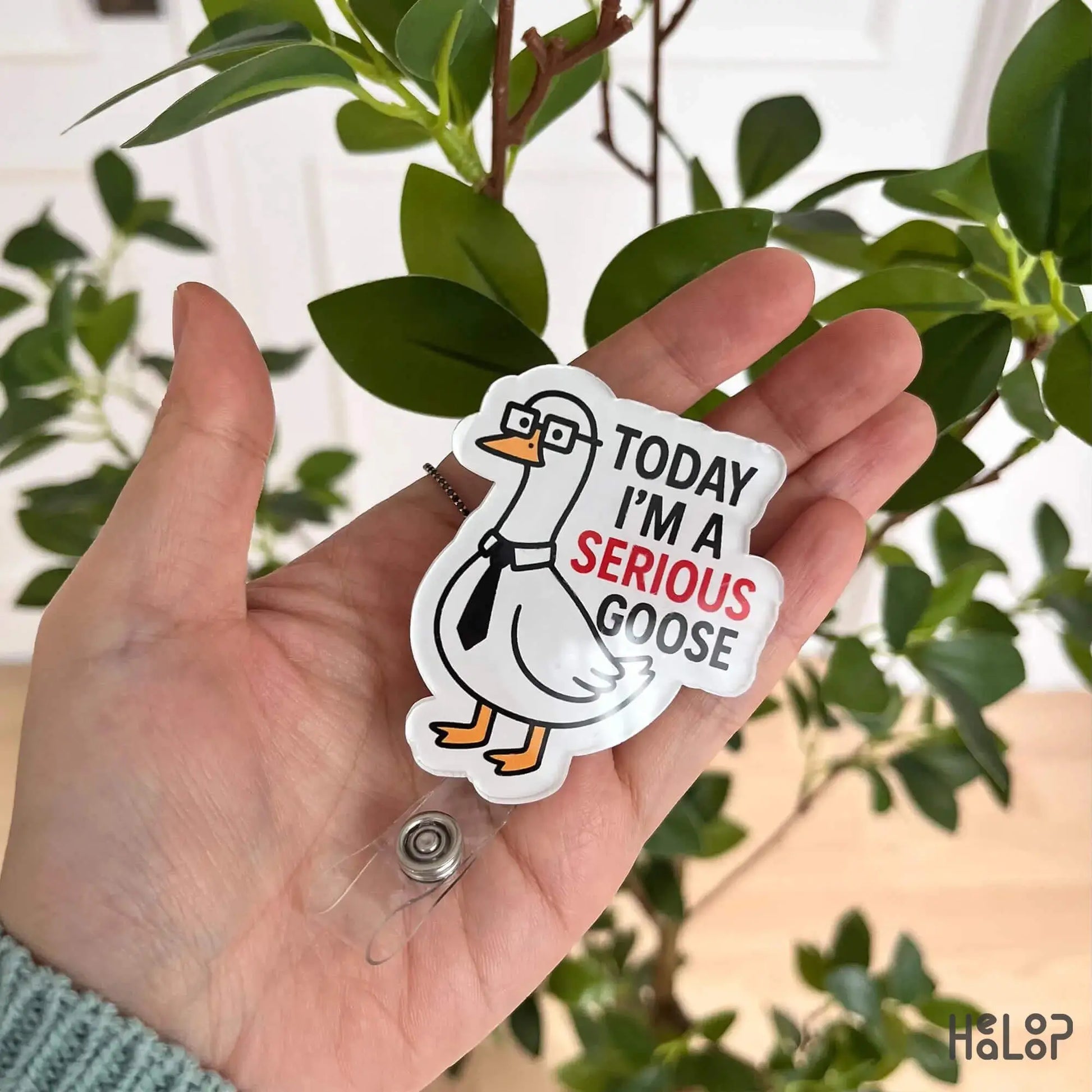 Funny acrylic goose badge reel held in hand – ideal for nurses, teachers, or office staff