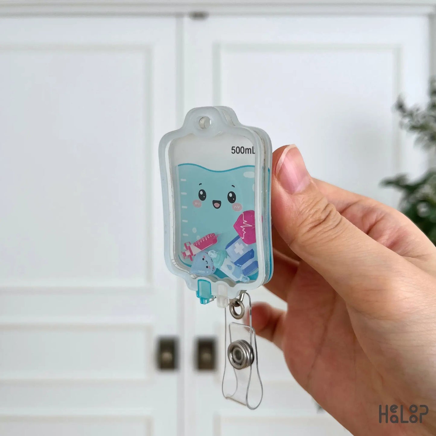 Side profile of Cute IV Bag Shaker Badge Reel highlighting premium layered acrylic construction and movable medical shaker pieces.