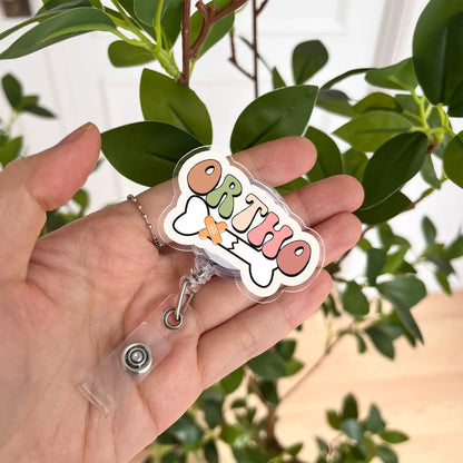 Cute orthopedic badge reel with colorful ORTHO lettering – great gift for nurses and healthcare workers