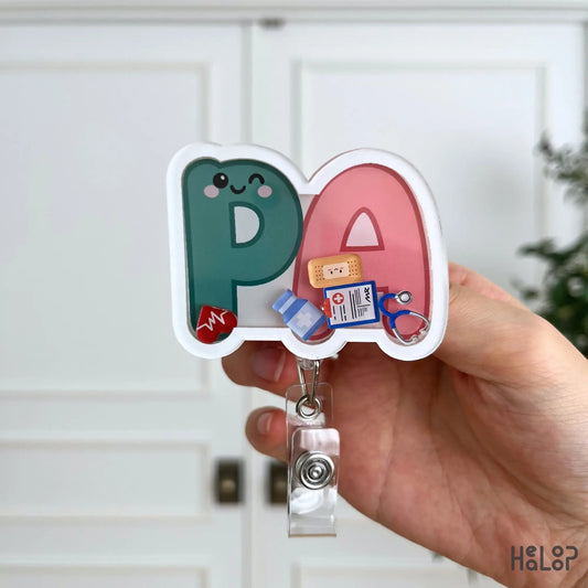 Close-up of the Cute PA Shaker Badge Reel featuring colorful medical charms and a fun Physician Assistant badge holder design.