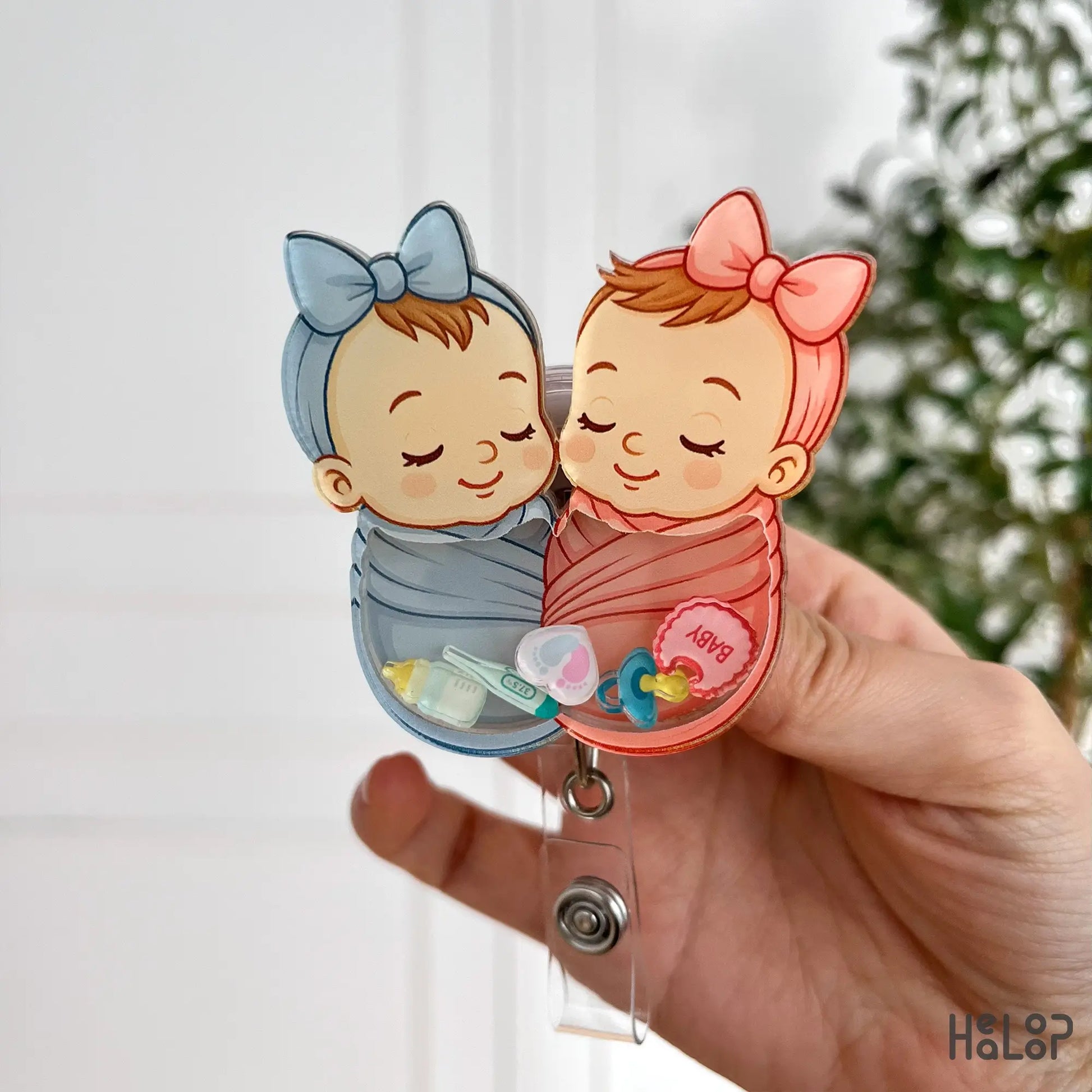 Cute swaddle baby badge reel with boy and girl newborn design, ideal nurse gift from Healoop