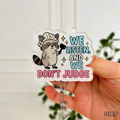 Front close-up of “We Listen and We Don’t Judge” badge reel – funny retractable ID holder by Healoop