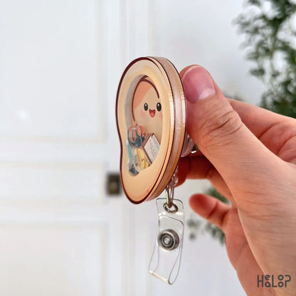 Ear shaped medical badge reel for hearing care professionals