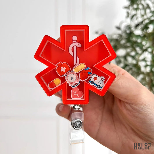 EMS badge reel with red star design, pills, heart, and ambulance icons