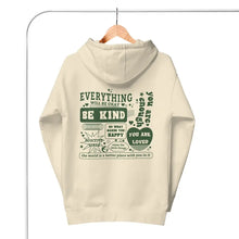 Everything Will Be Okay hoodie in Bone color with back print hanging.