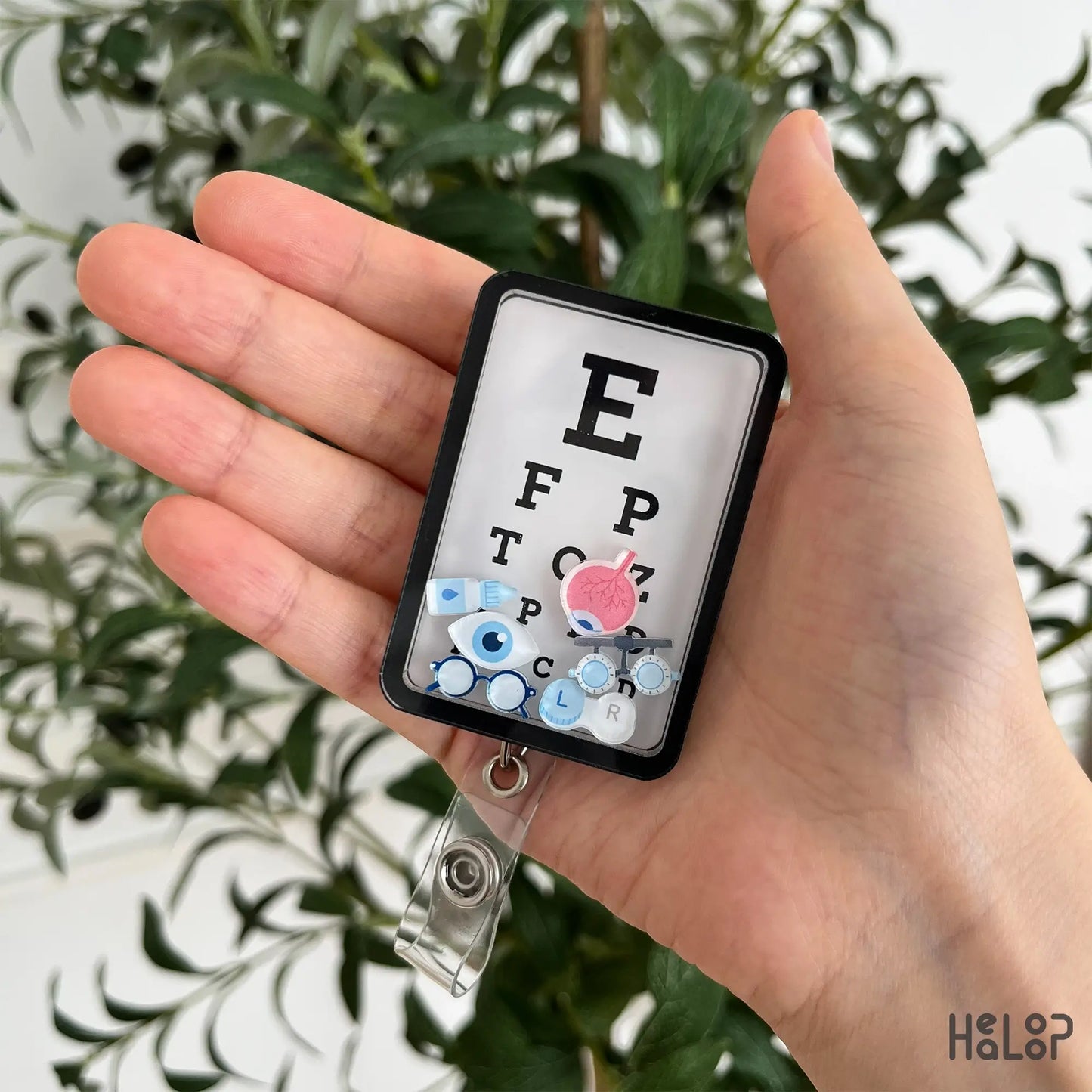 Eye Chart Shaker Badge Reel with moving ophthalmology charms for optometrists and eye care professionals.