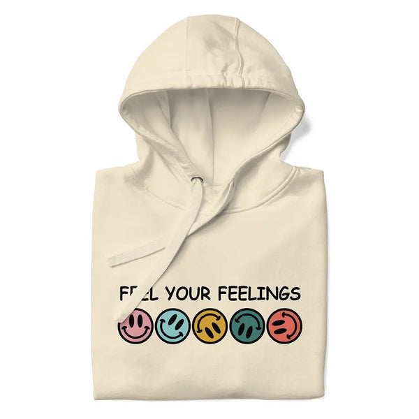 Folded 'Feel Your Feelings' hoodie in Bone, highlighting its soft fabric and minimalist printed text design.