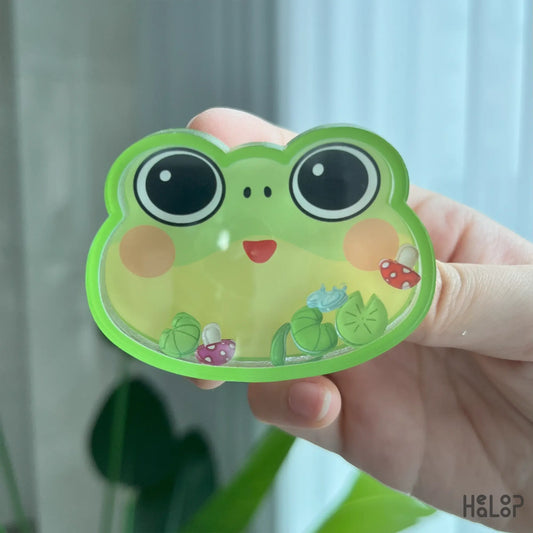 Frog shaker phone grip in hand, kawaii acrylic phone holder