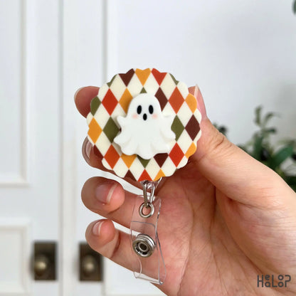 Ghost Badge Reel with orange, brown and olive argyle pattern