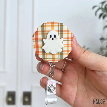 Ghost Badge Reel with orange and olive plaid fall background