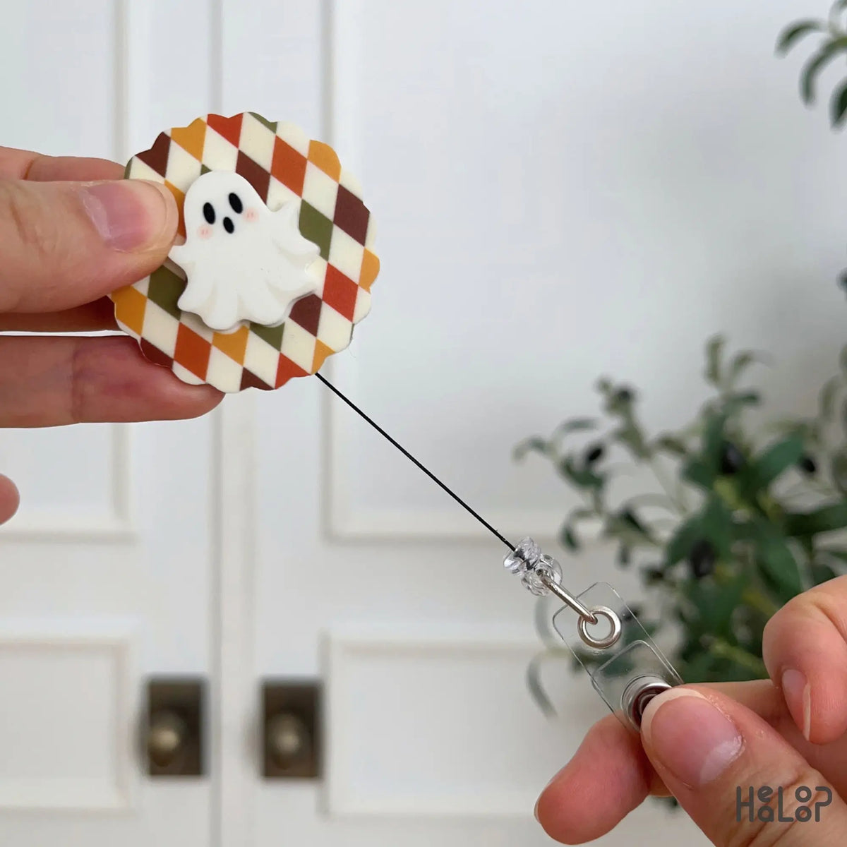 Retractable Ghost Badge Reel with fall argyle pattern and clear ID strap