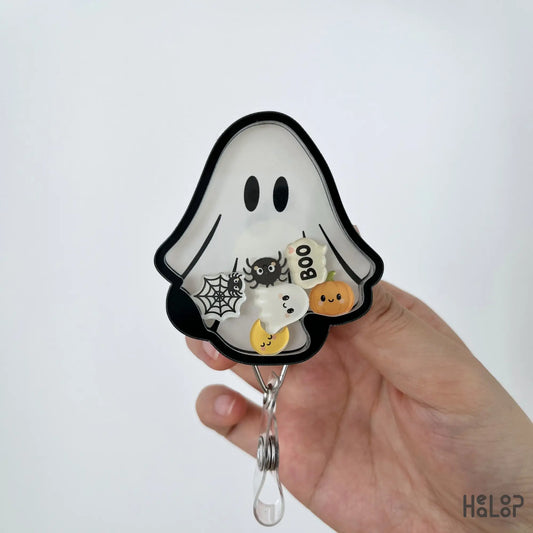 Detailed close-up of Ghost Halloween acrylic shaker badge reel with spooky moving charms