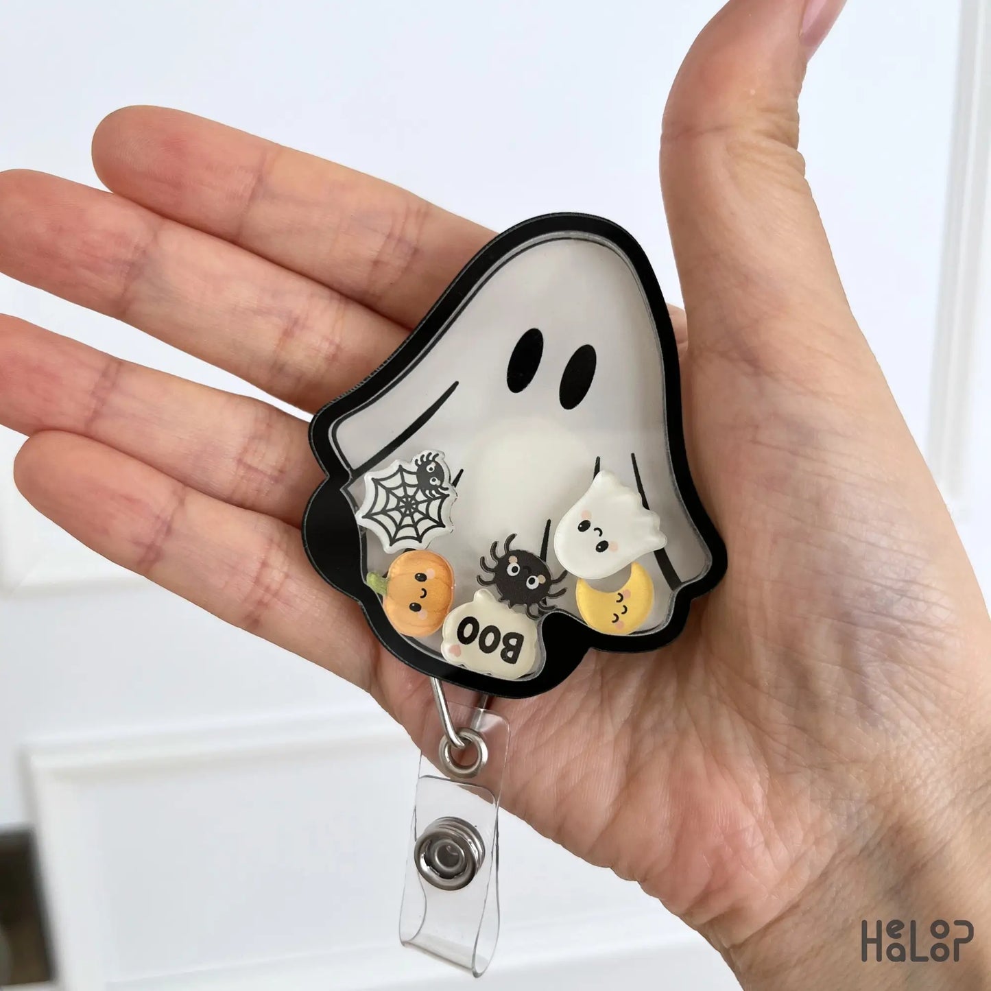 Cute Ghost Halloween Shaker Badge Reel featuring pumpkin, ghost, spider, moon and web shaker charms