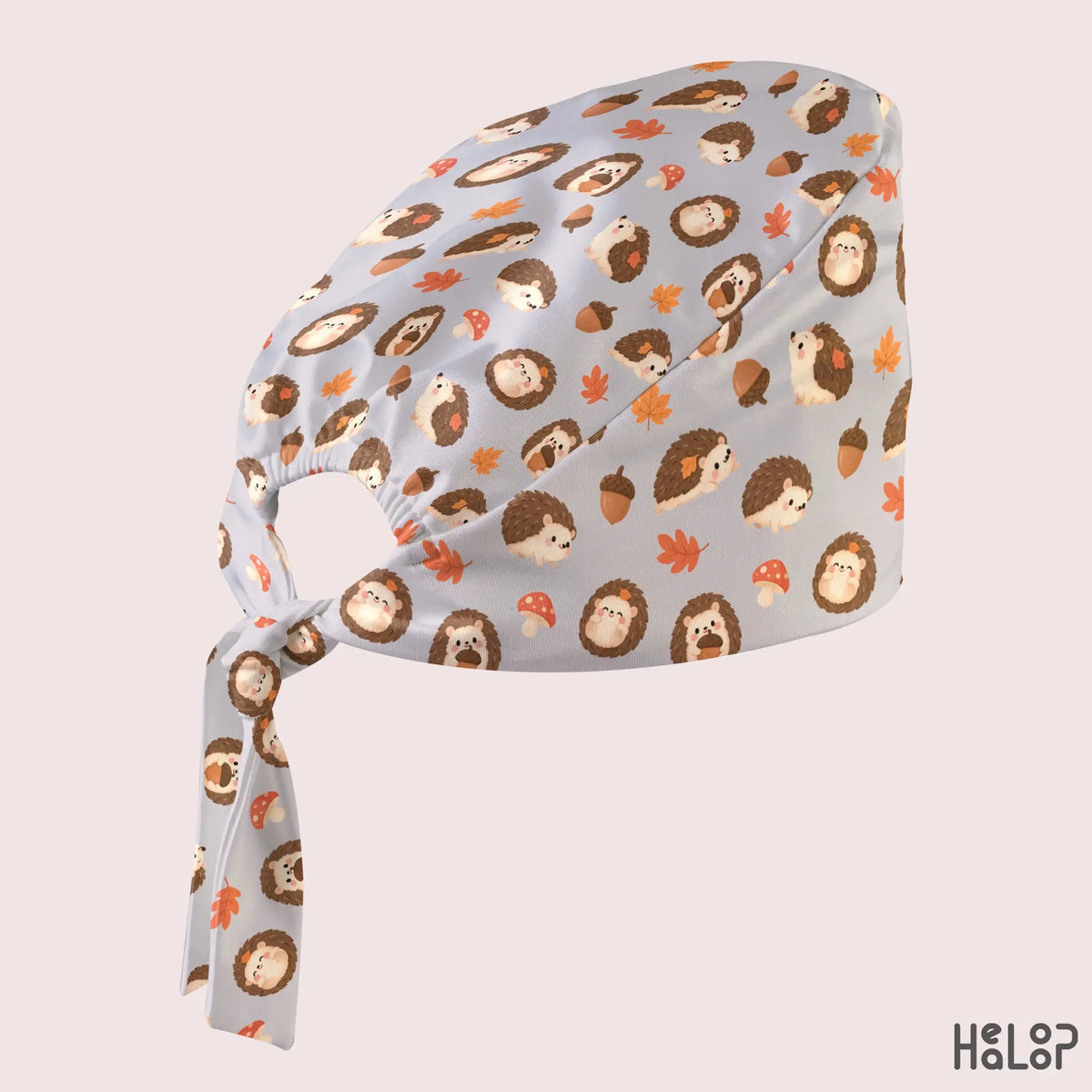 Hedgehog Classic Scrub Cap in an angled side view, showcasing the cute woodland hedgehog pattern, autumn-inspired details, and adjustable tie-back closure.