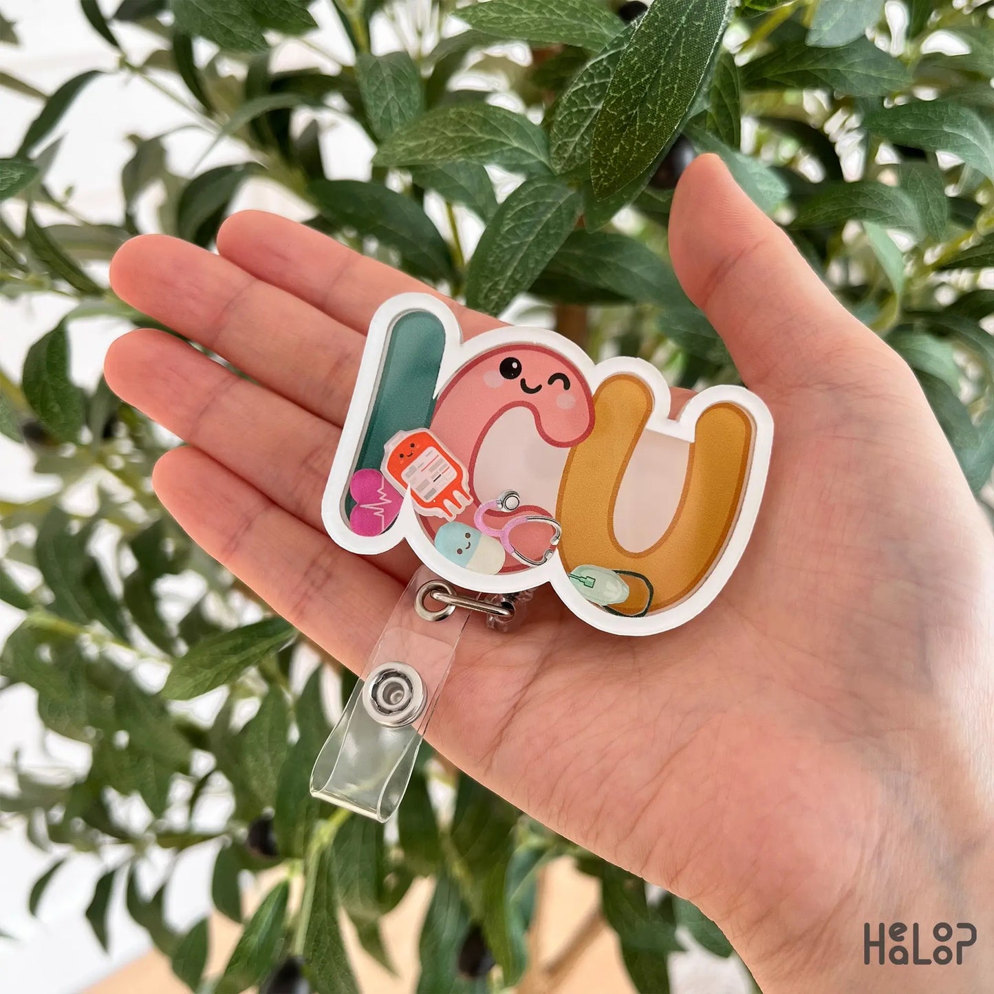 ICU nurse shaker badge reel with medical themed charms designed for intensive care nurses by Healoop