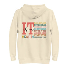 It Is Okay To hoodie in Bone with a back print of uplifting messages, a stylish and comforting piece for mental health awareness.