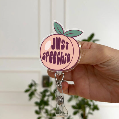 “Just Speechie” peach badge reel – retractable ID holder for speech therapists