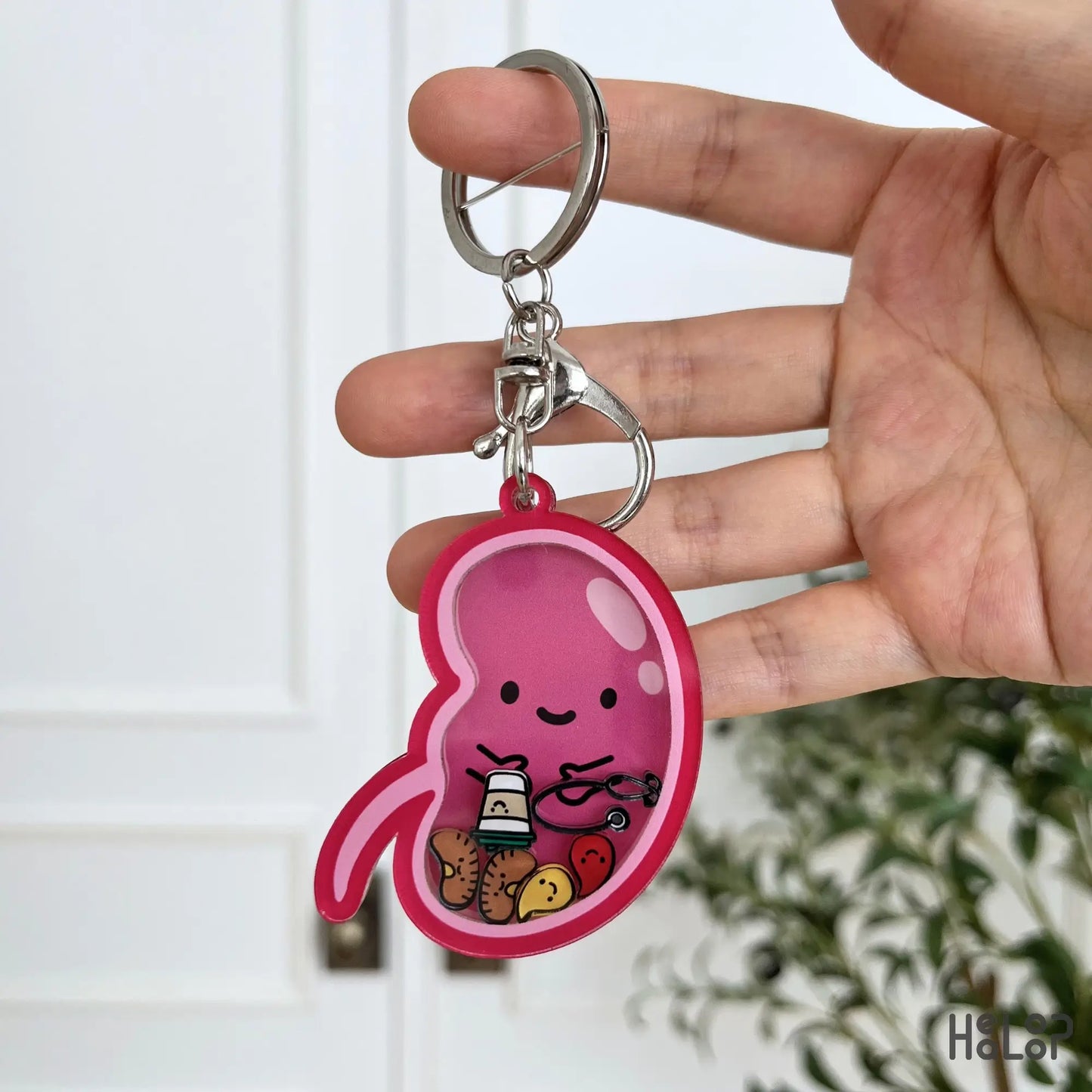 Kidney Shaker Keychain with colorful moving medical charms for nephrology nurses and healthcare professionals.