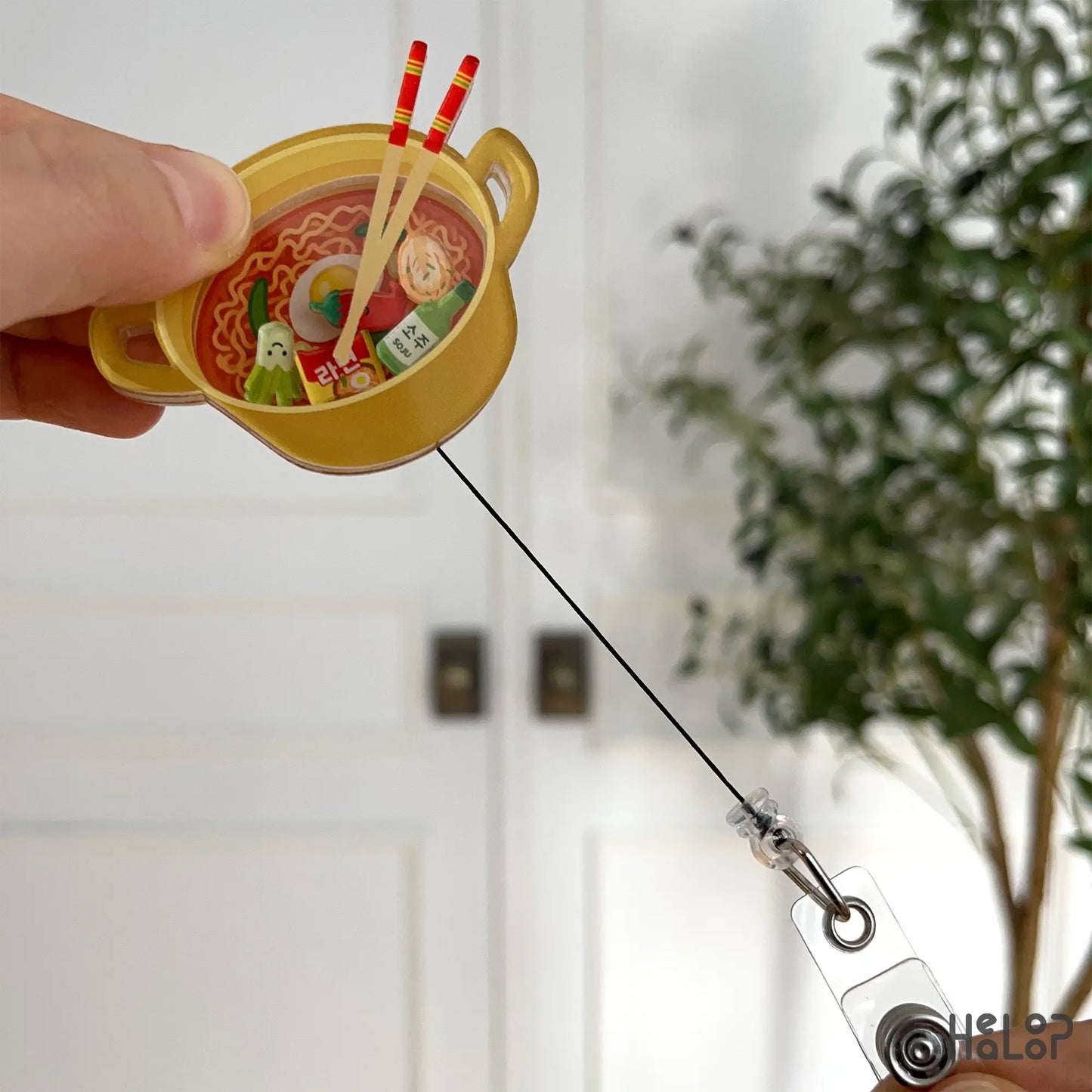Ramen shaker badge reel extended with black cord and clear ID clip