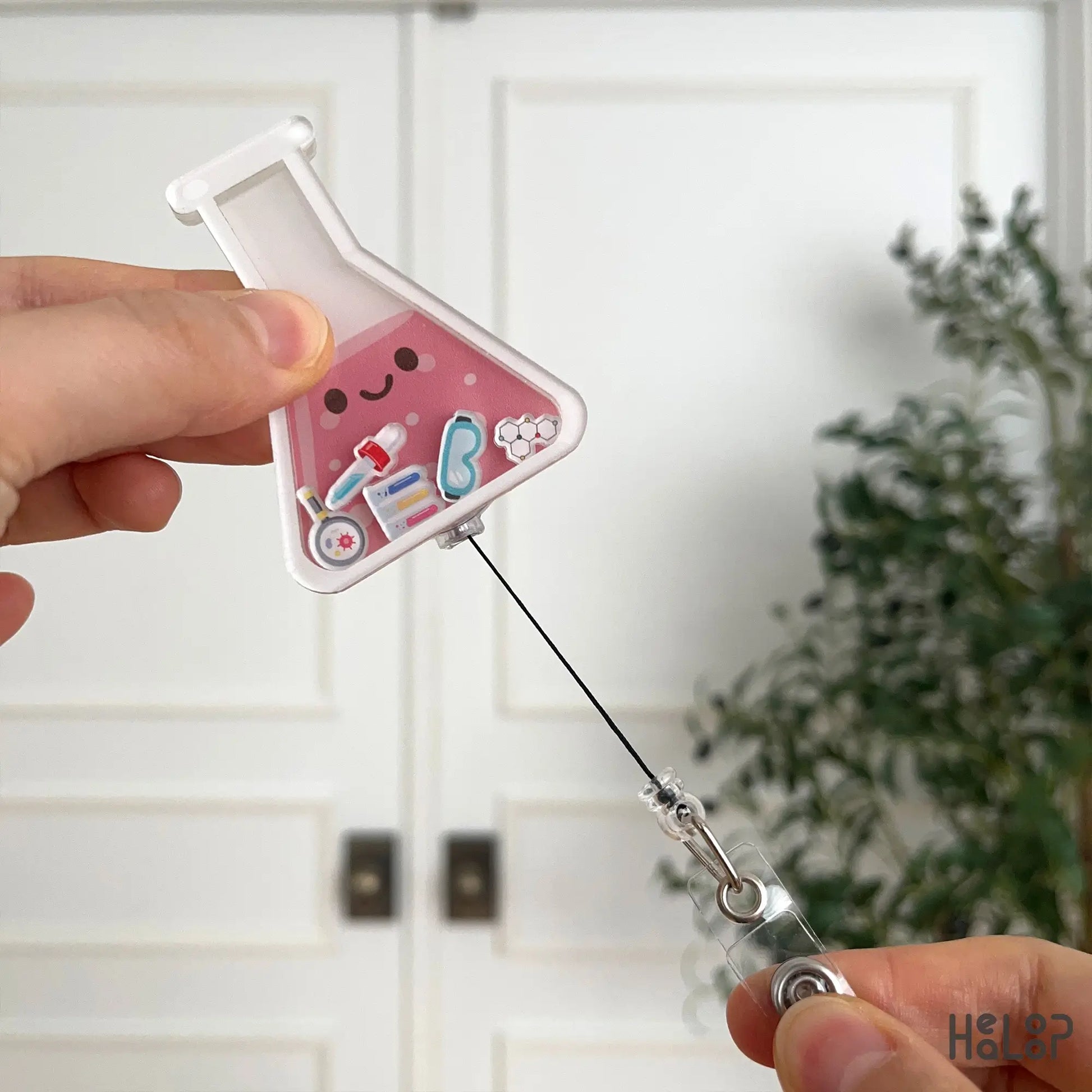 Lab badge reel with retractable cord extended for easy ID access