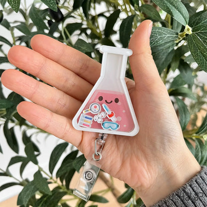 Lab shaker badge reel shown in hand for size reference and everyday wear