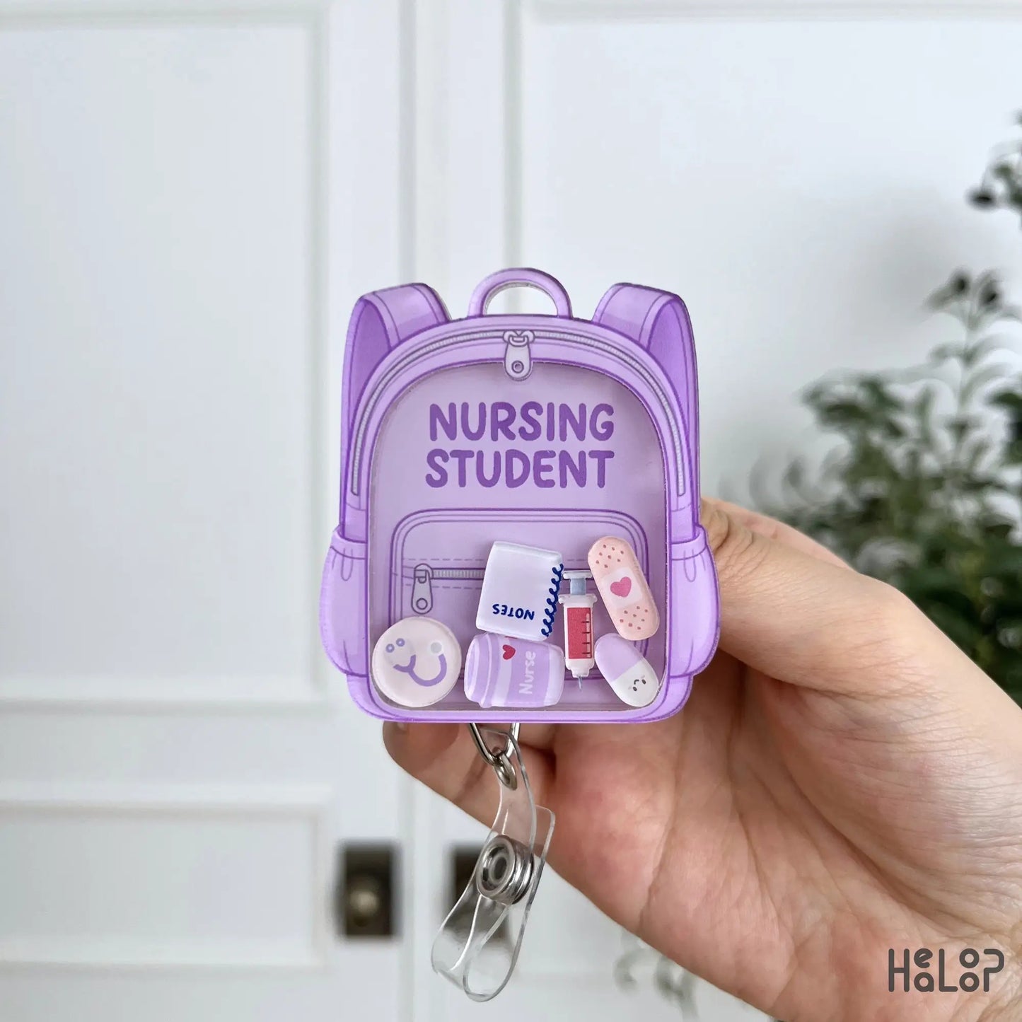 Lavender Nursing Student Shaker Badge Reel with moving medical charms and retractable badge holder