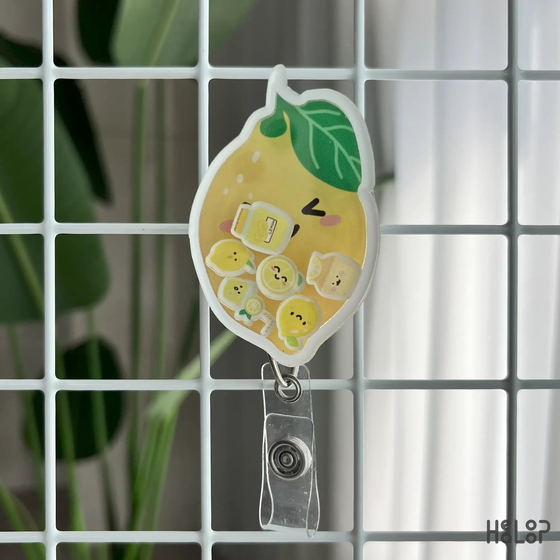 lemon shaker badge reel with smiling lemon face and mini charms, perfect for nurse accessories