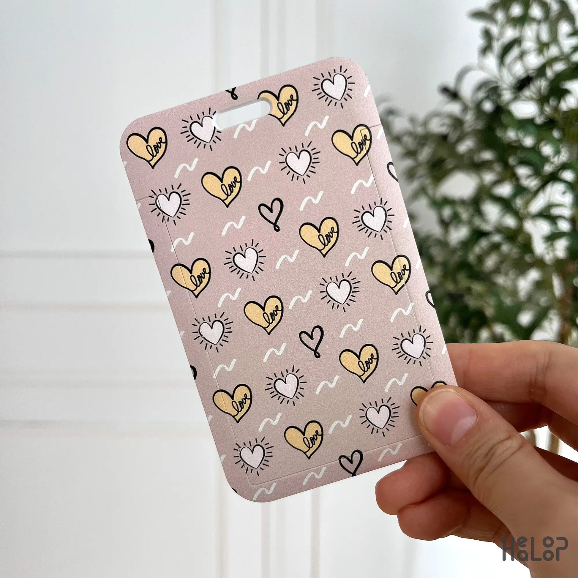 cute love heart ID badge holder in pink and yellow with playful “love” print