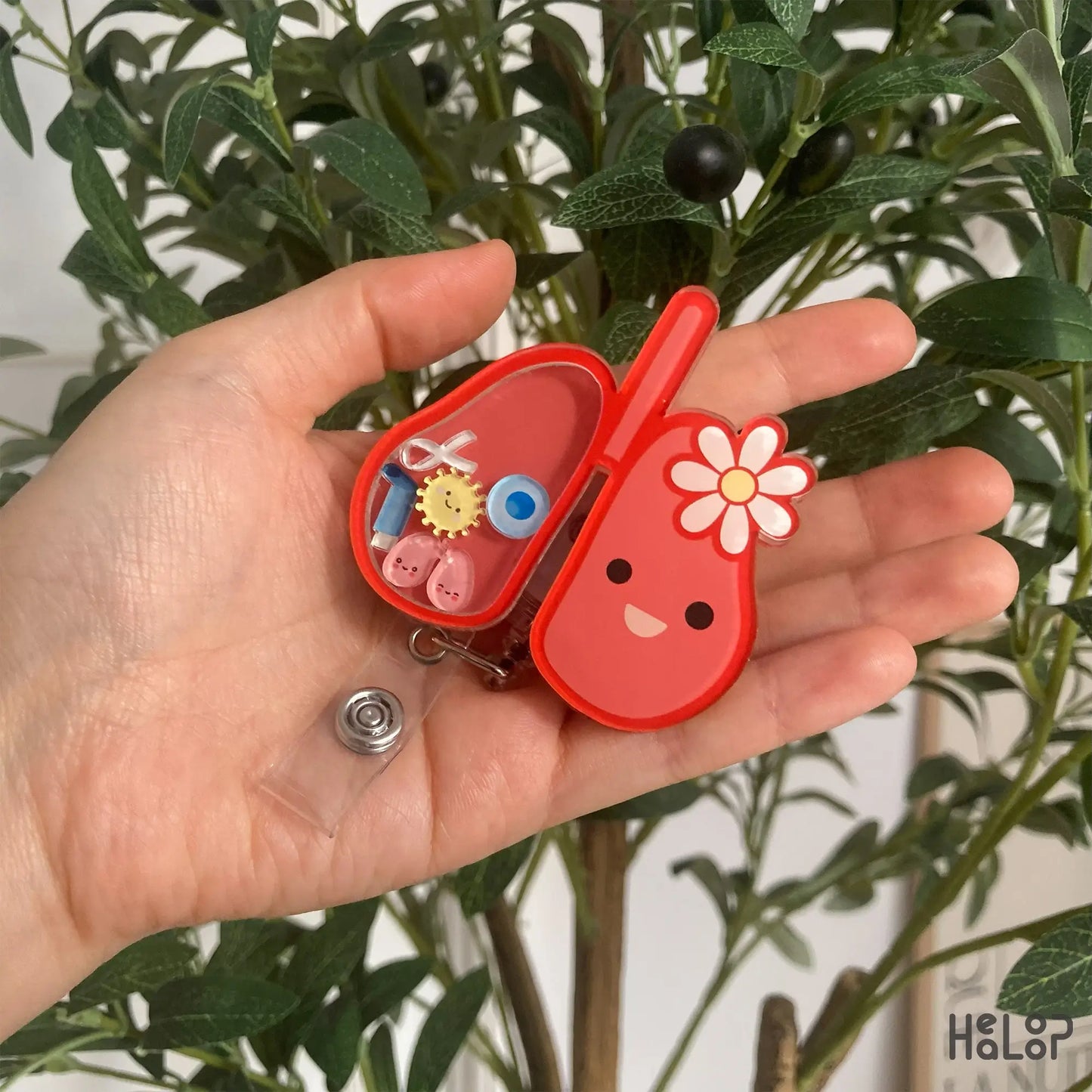 Cute lung badge reel held in hand — perfect for respiratory therapists and nurses