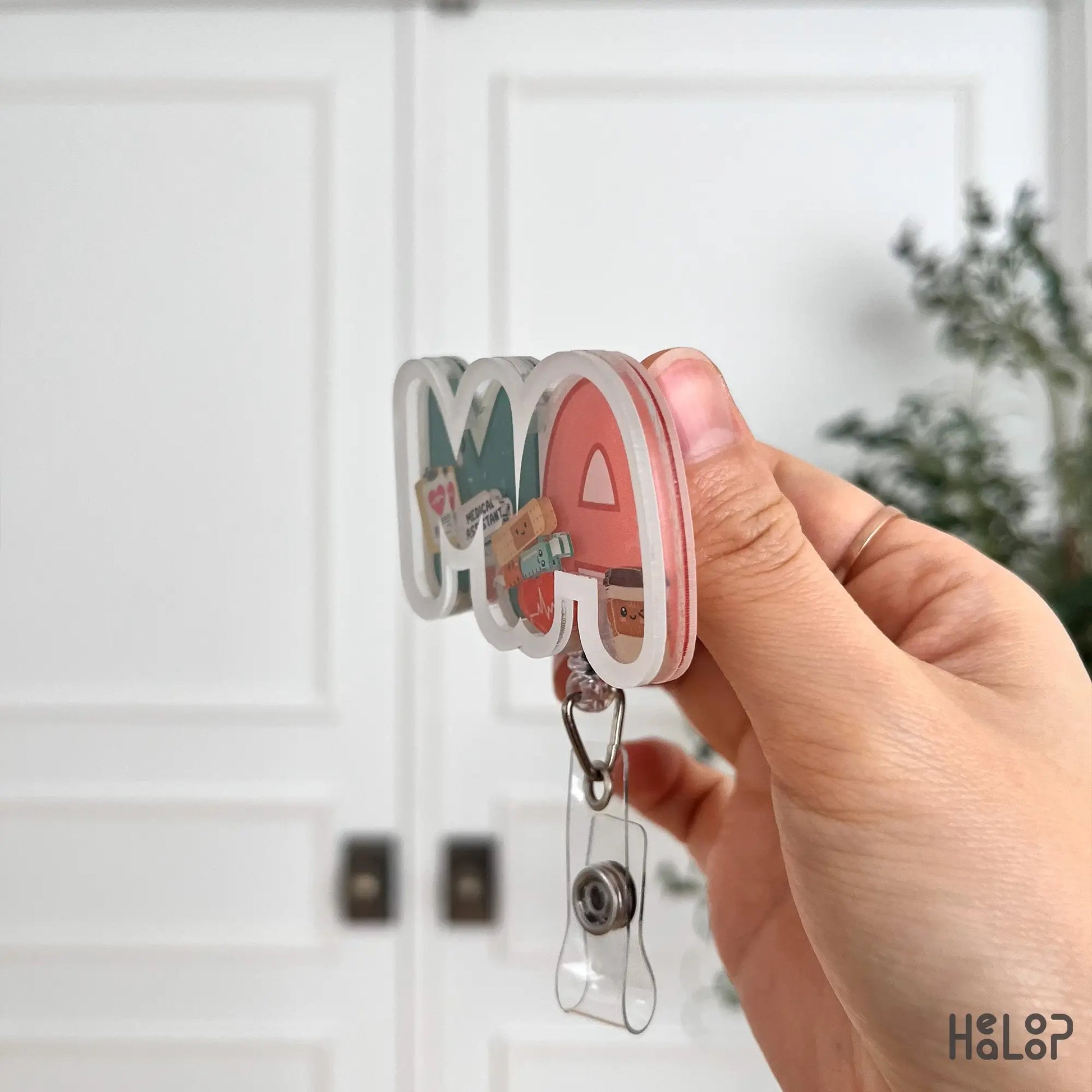 Acrylic MA badge reel side profile showing layered shaker design