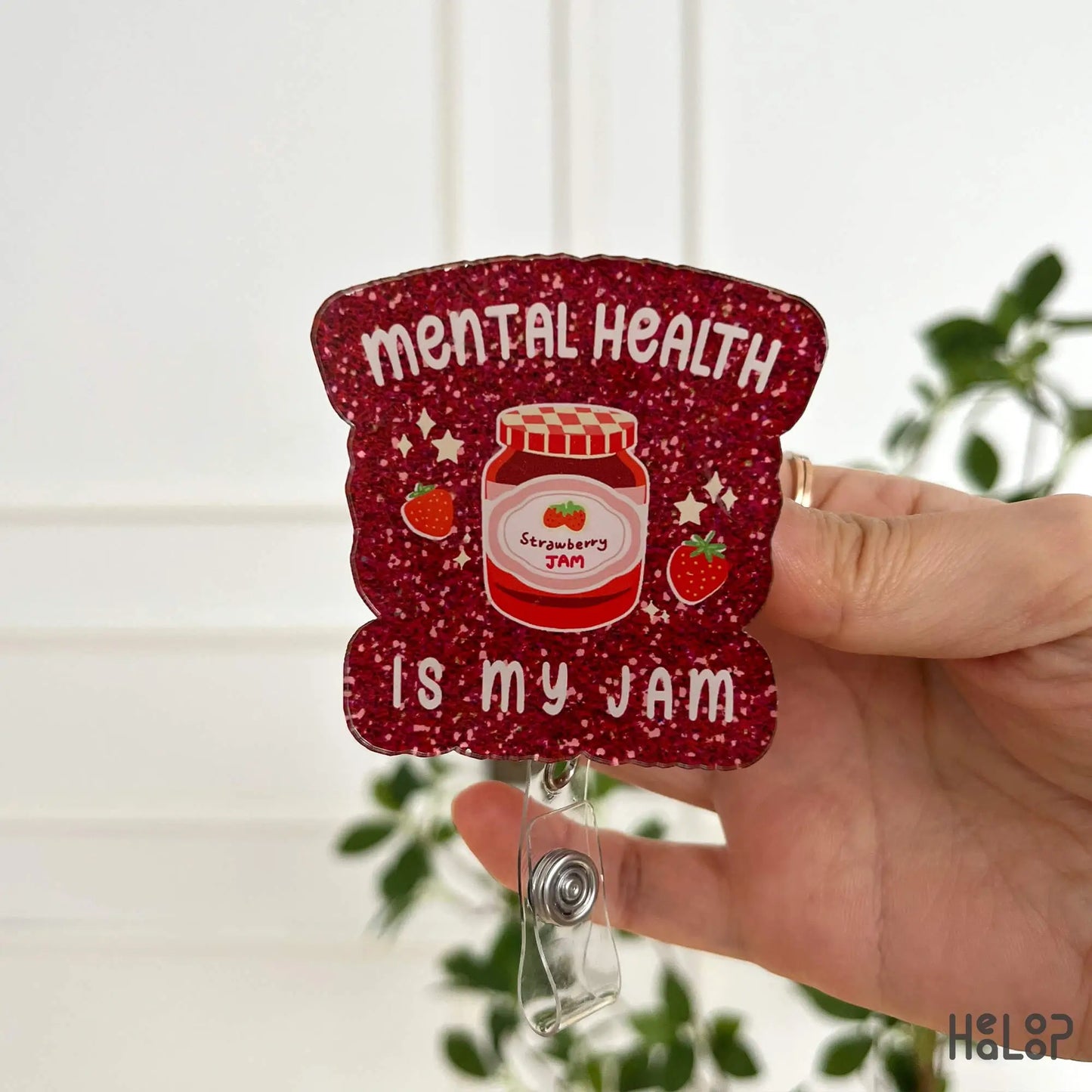 Healoop “Mental Health Is My Jam” badge reel with red glitter-print finish and strawberry jam jar art