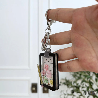 Side view of the layered acrylic Mental Health Board Shaker Keychain showing its shaker construction.