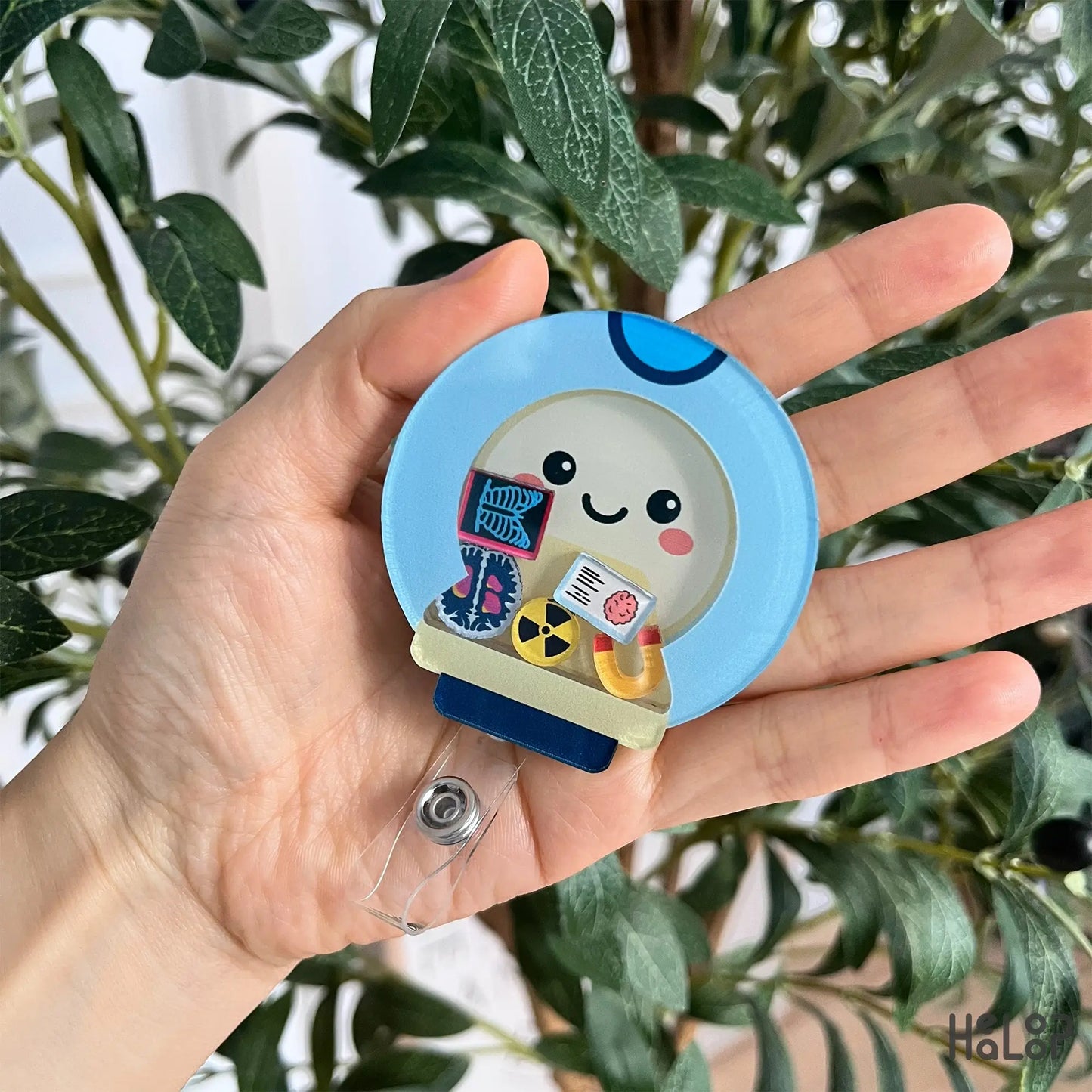 mri shaker badge reel shown in hand