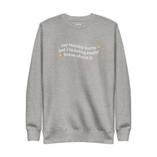 Folded My Tummy Hurts sweatshirt in Carbon Grey with embroidered text, 'My tummy hurts but I'm being really brave about it'