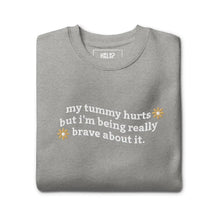 Folded My Tummy Hurts sweatshirt in Carbon Grey with embroidered text, 'My tummy hurts but I'm being really brave about it'