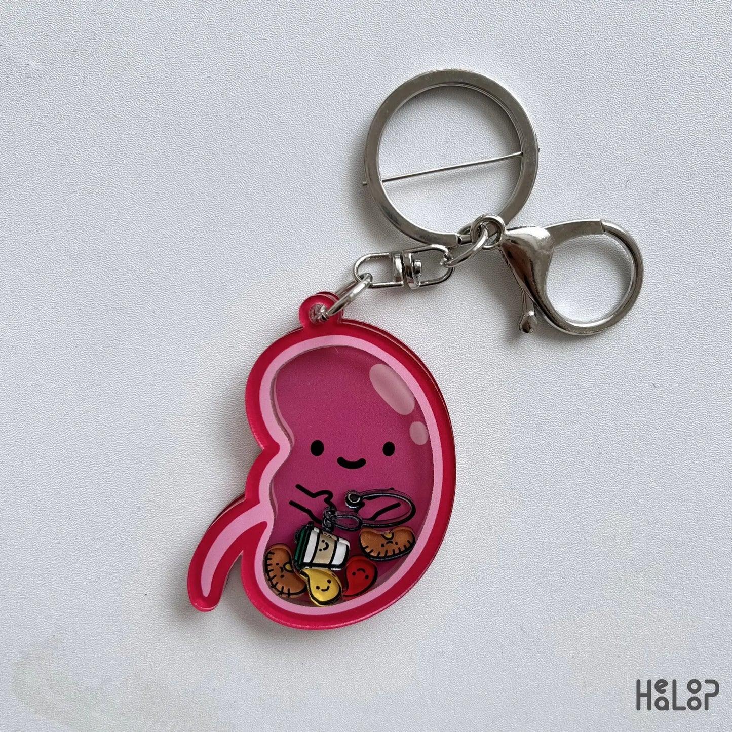 Cute Kidney Shaker Keychain with miniature medical charms for dialysis nurses, nephrology nurses, and anatomy lovers.