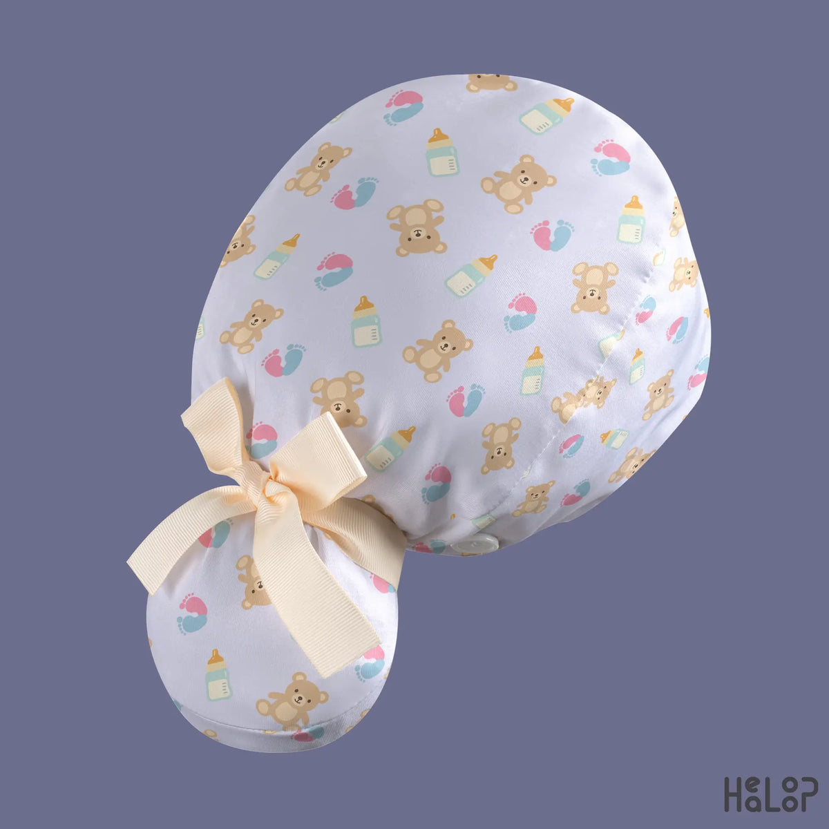 Ponytail scrub cap for NICU and labor and delivery nurses, shown from an angled back view with a teddy bear pattern, roomy ponytail pouch, and cream bow.