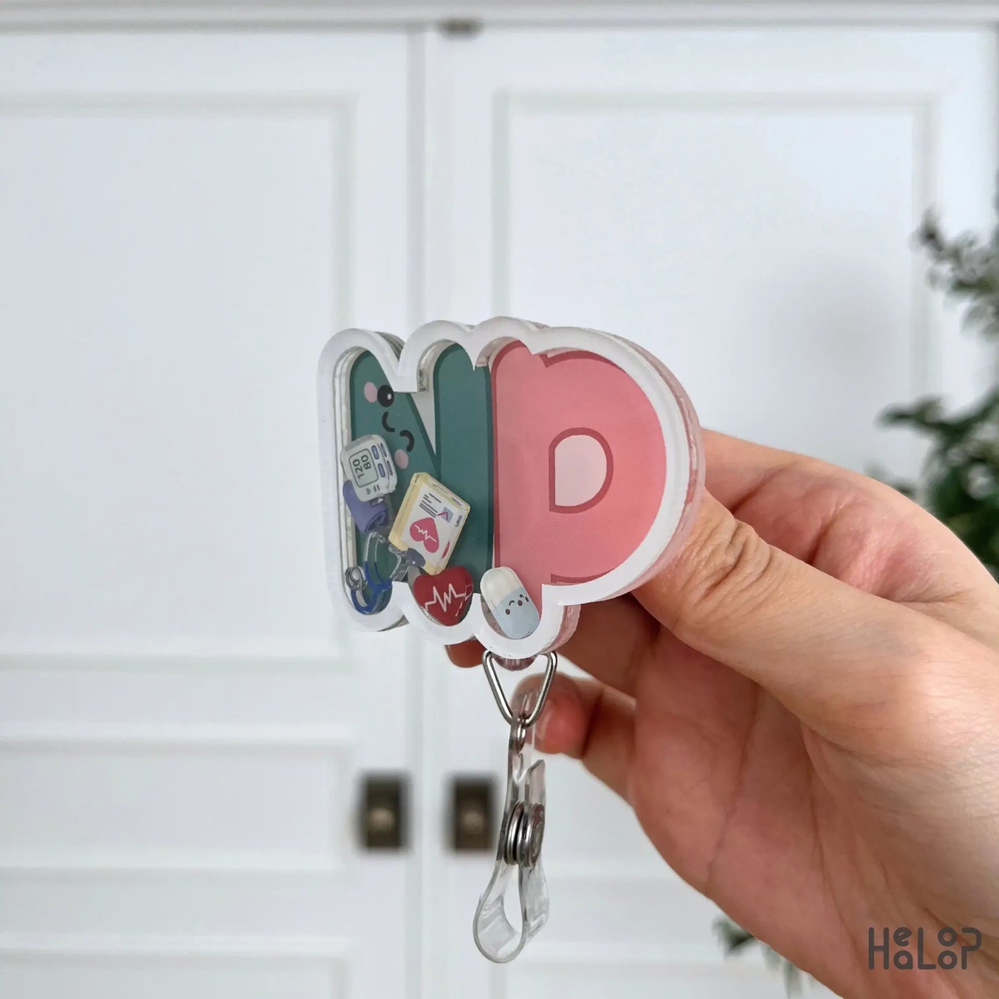 Premium layered acrylic NP Shaker Badge Reel side profile showing durable shaker construction.