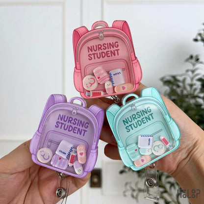 Pink, lavender and teal Nursing Student Shaker Badge Reels with medical charms for nursing students