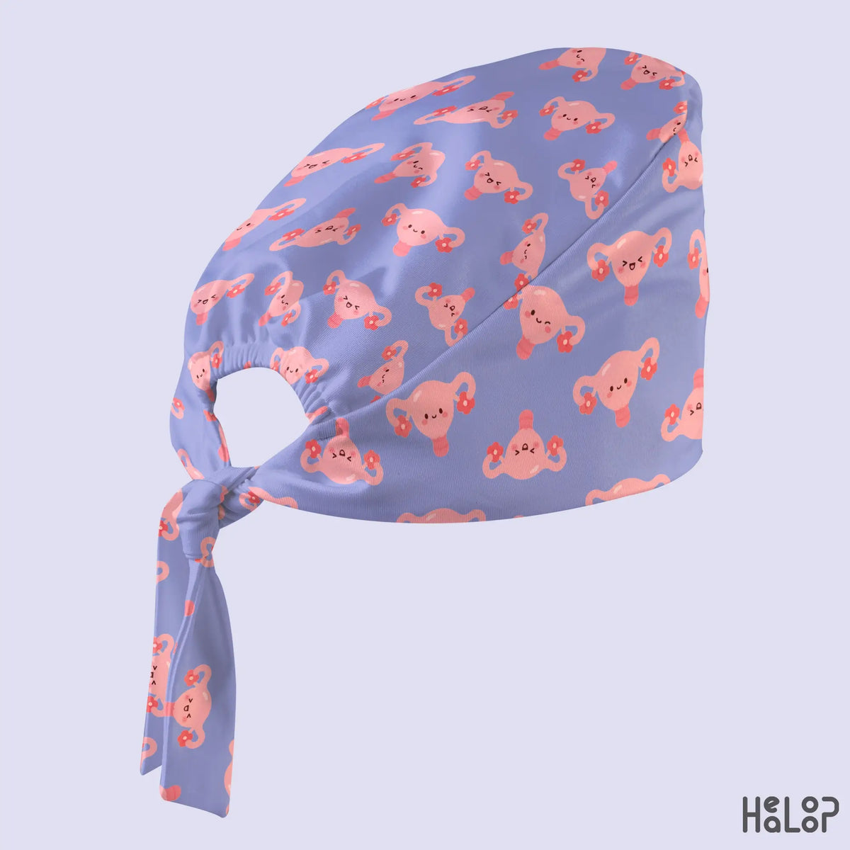 OBGYN uterus scrub cap angled view showing a lavender purple surgical hat with adorable pink uterus illustrations and matching adjustable ties.