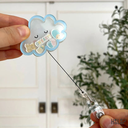 Oh Baby cloud ID badge reel showing extended pull cord for work ID access.