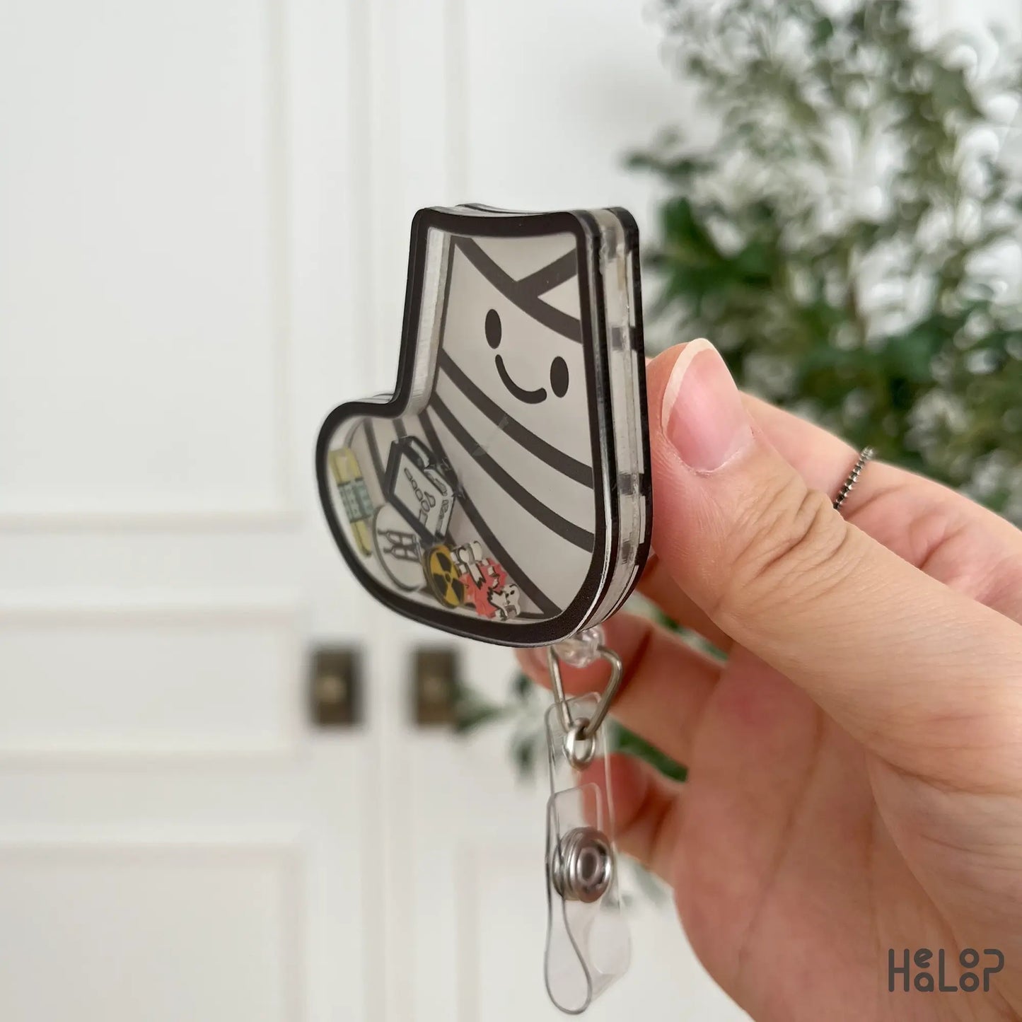 Cute ortho shaker badge reel with medical-themed charms – side angle