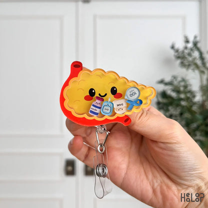 Detailed view of pancreas shaker badge reel with insulin and glucose inspired charms