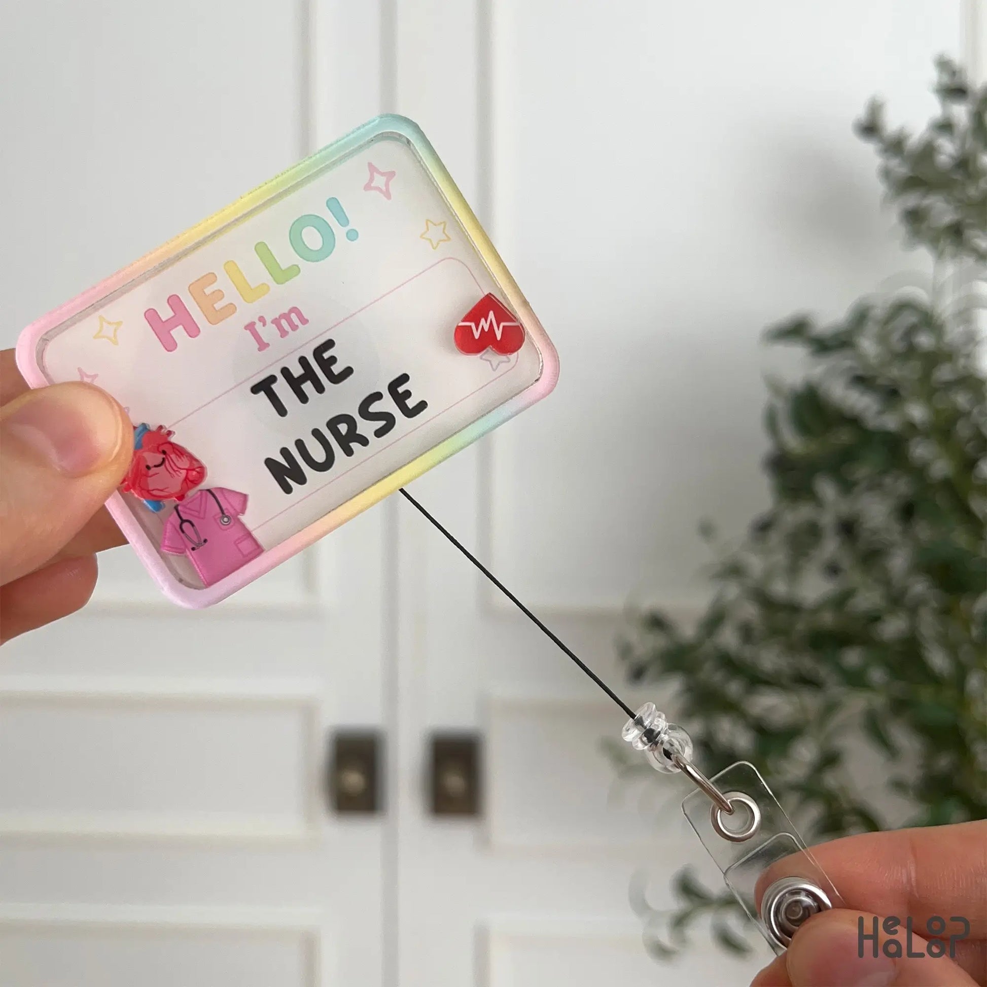 Retractable Hello I'm The Nurse shaker badge reel with customizable text and charms